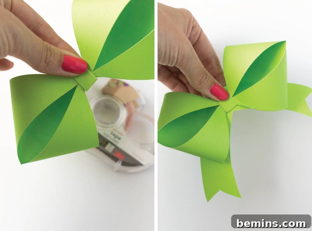 Pinching Green Paper to Form Diamond Fold Bow