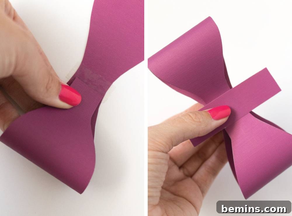 Hand Demonstrating How to Make Layered Bow with Purple Paper