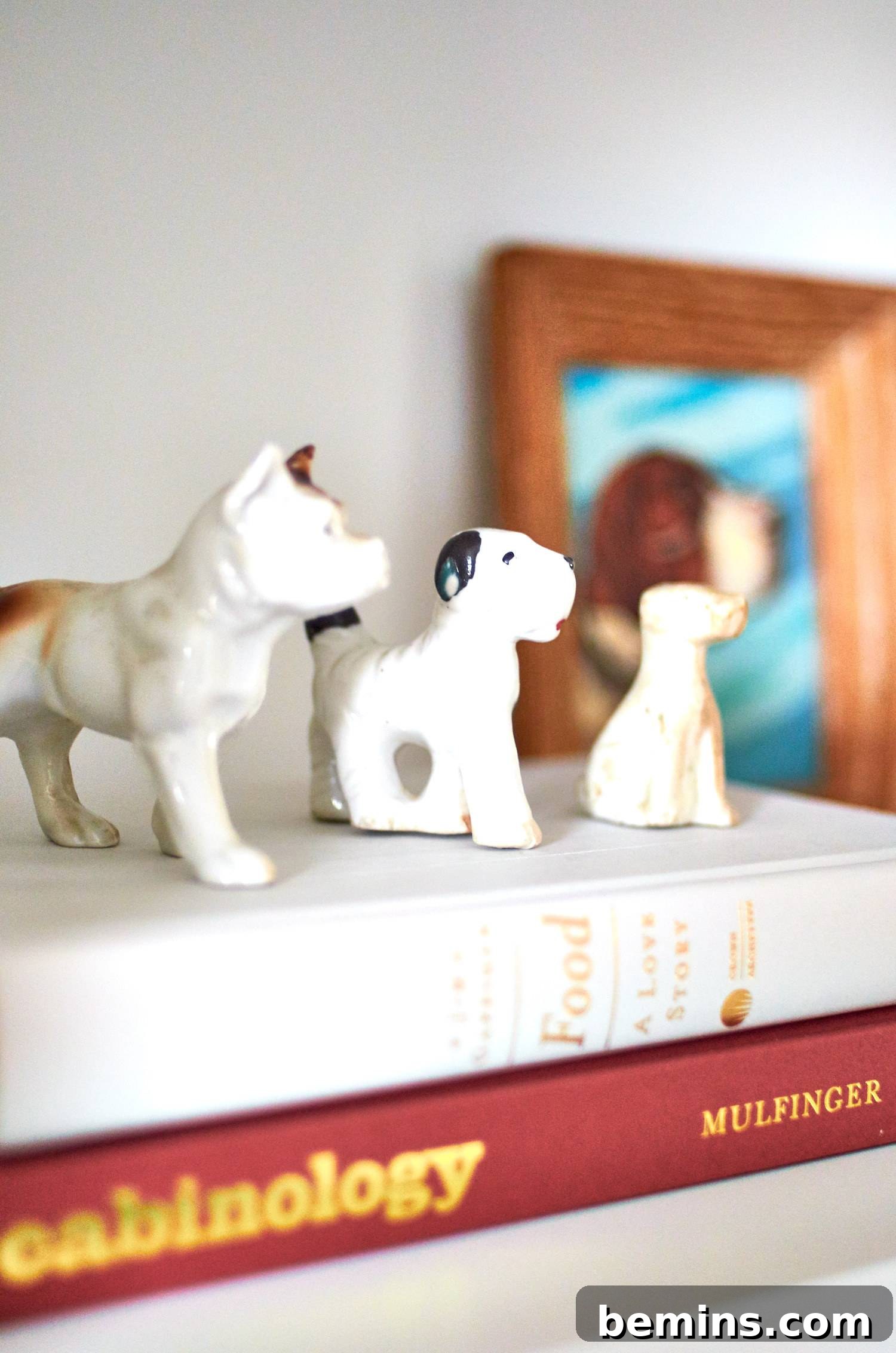 Small dog figures sitting on a stack of books. Charming decorative touches add personality and character to the room.
