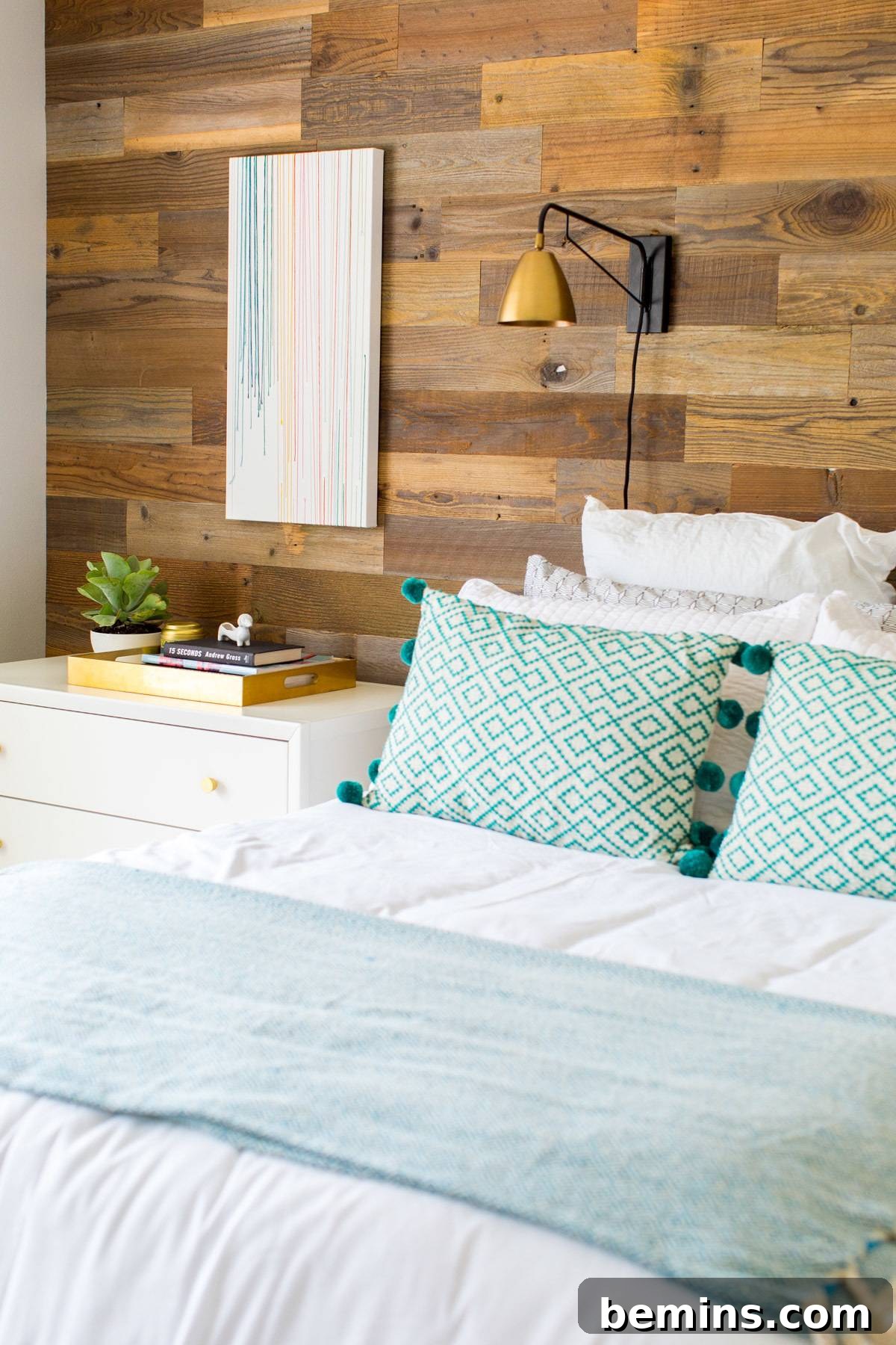 Creating a Haven: Elevate Your Bed to Ultimate Comfort 6 Cozy bedroom with a wood accent wall, creating a warm and inviting atmosphere.