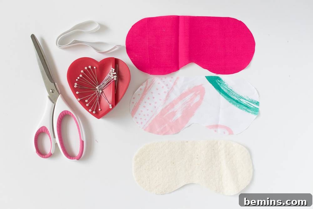 Sewing supplies laid out on a table, including scissors, fabric, and thread.