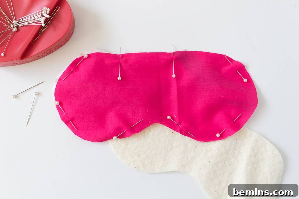 Fabric pieces pinned together in preparation for sewing.