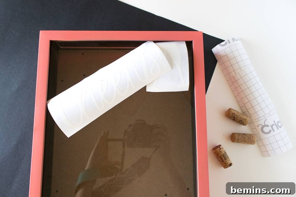 A pink picture frame with white paper placed on top for customization.