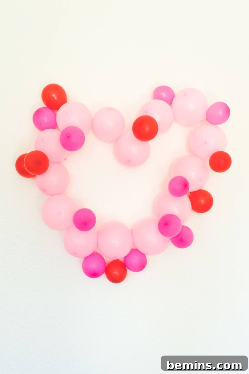 Heart made of different colors of pink balloons