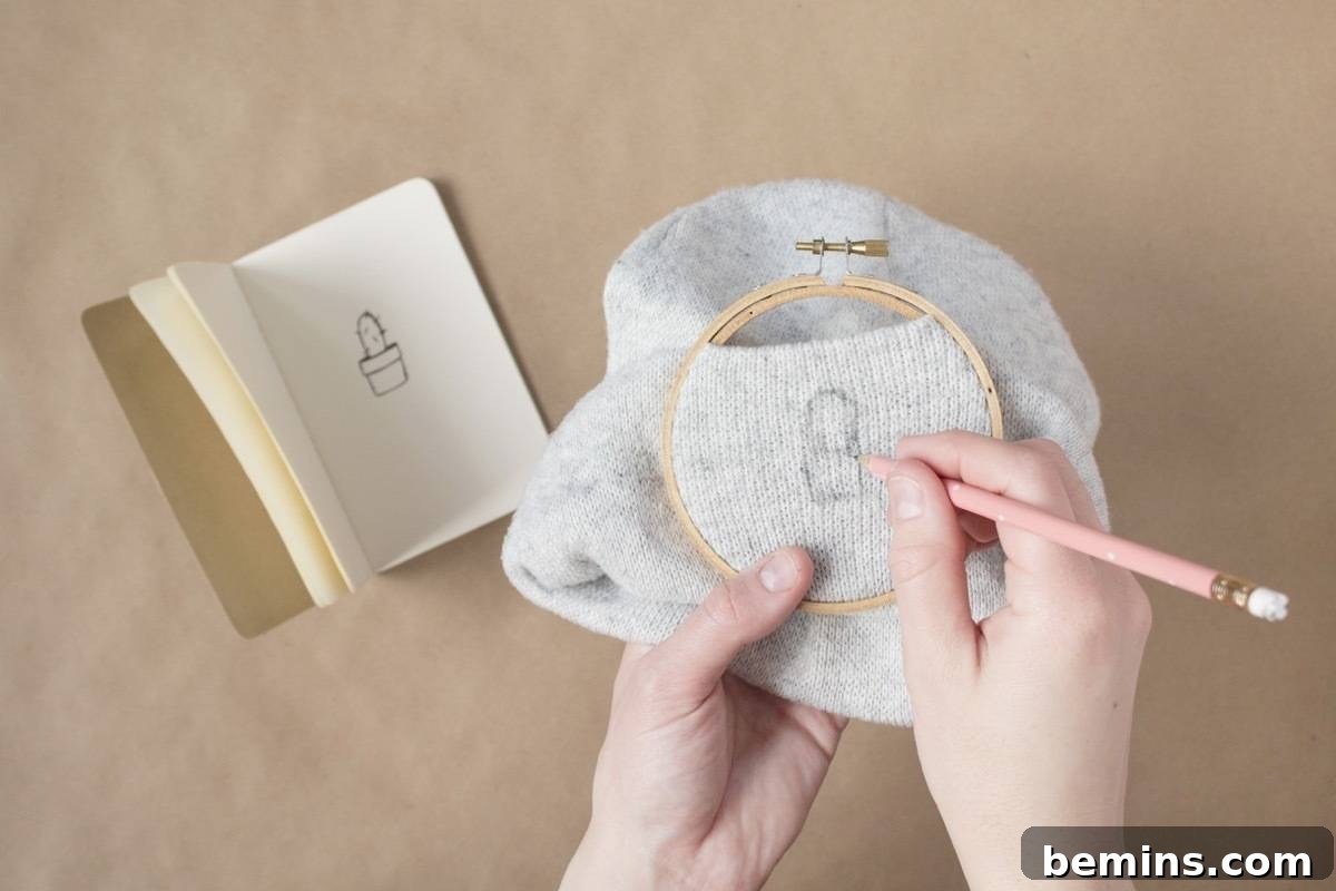 Tracing the design outline onto the beanie
