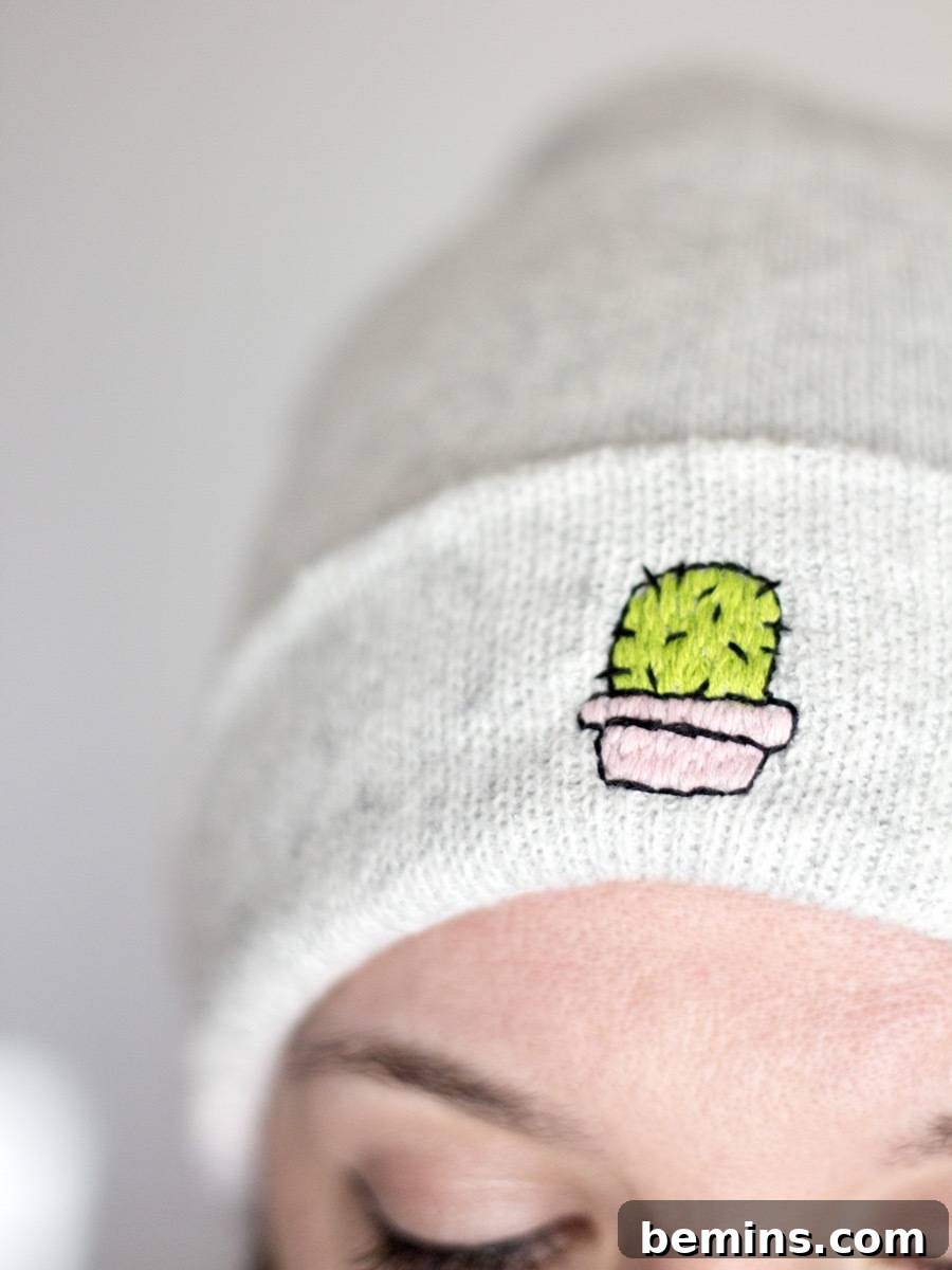 Finished embroidered beanie with a cactus design