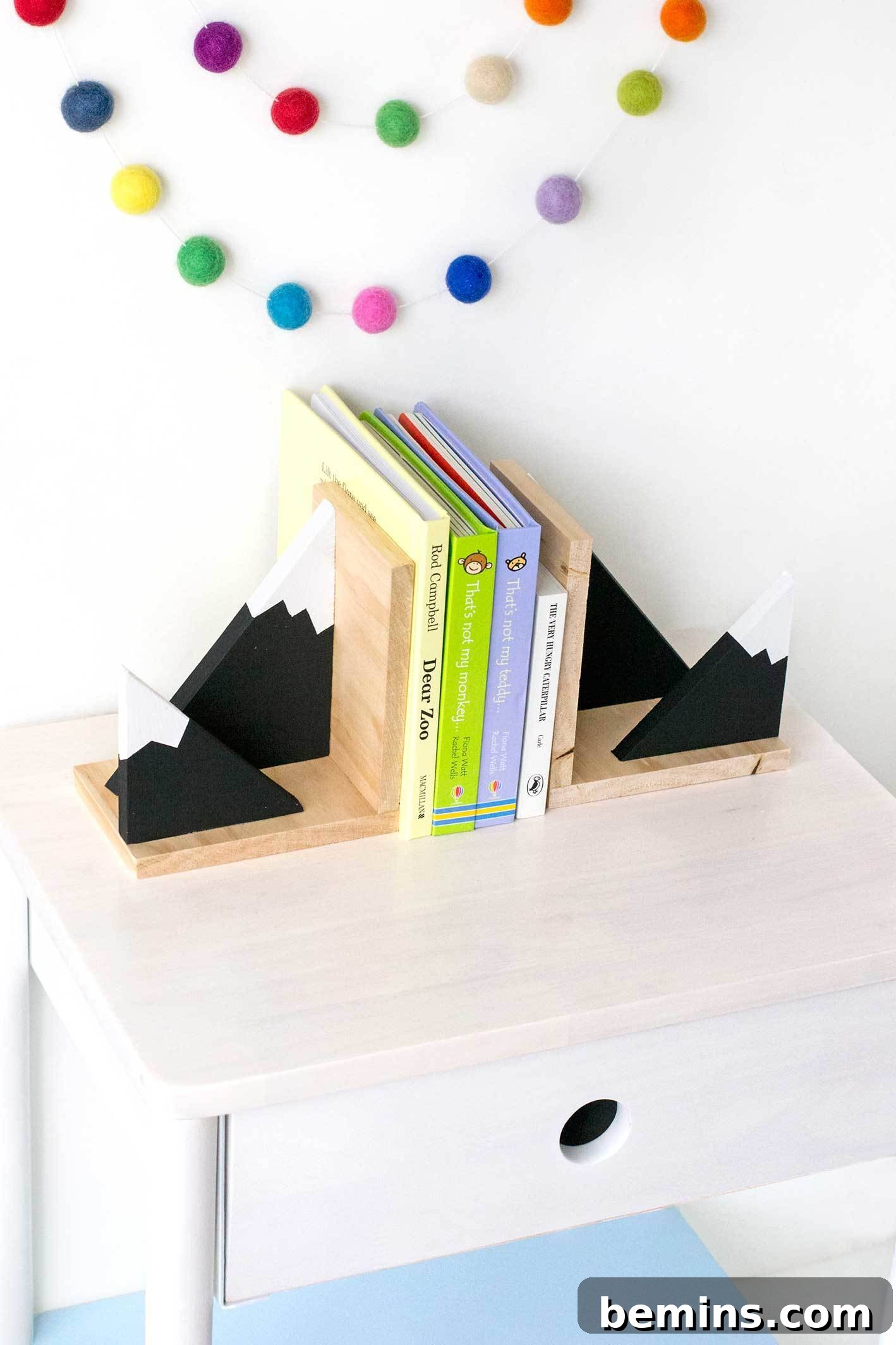 Close-up of finished mountain bookends holding books