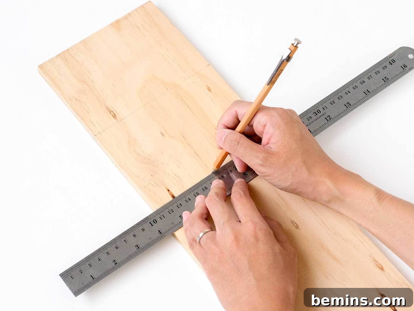 Measuring and cutting wood for the base
