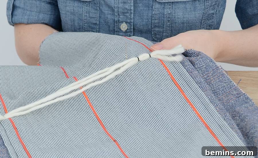 Anthropologie-Inspired DIY Pillow Project 8 add the decorative yarn strips