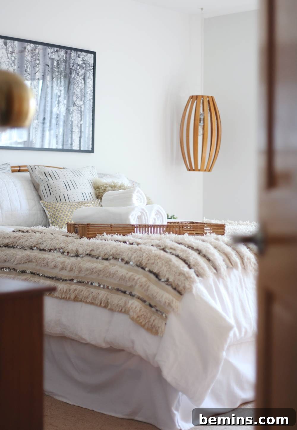 Neutral bohemian bedroom with a Moroccan wedding blanket.