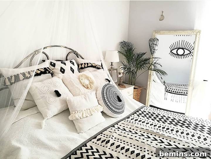 Black and white bohemian bedroom with an all-seeing eye.