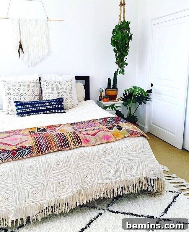 Boho bedroom with textures, plants, and a macrame wall hanging.