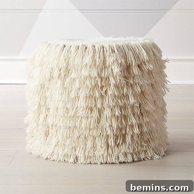 Fringed pouf from Land of Nod.
