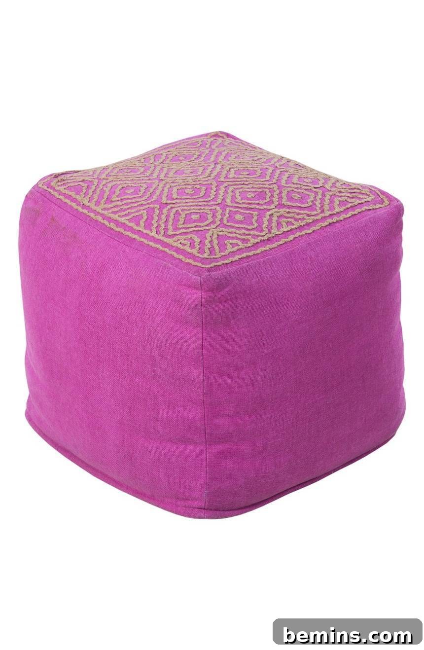 Square shaped pink color pouf.