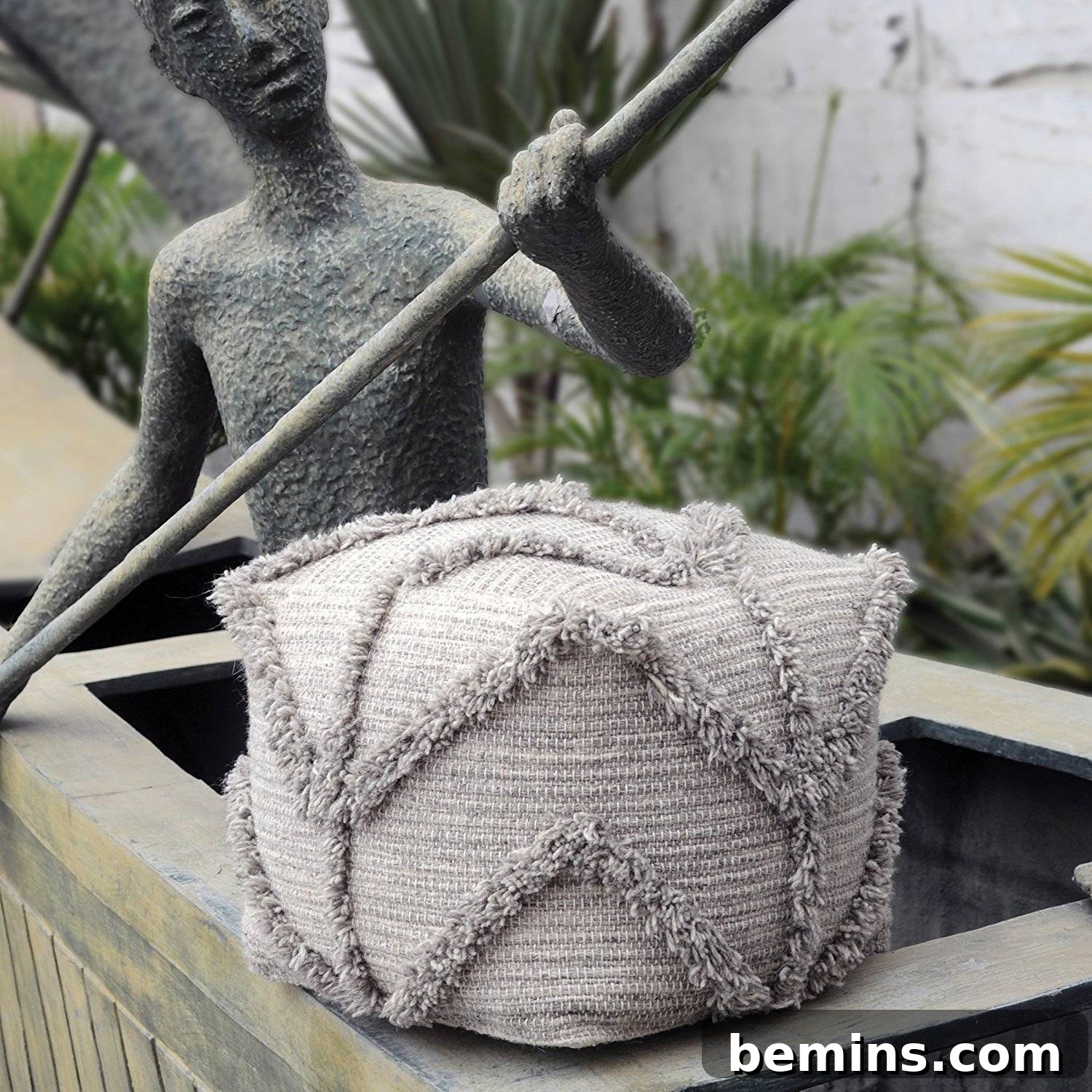 Fringed and textured pouf for a boho home.