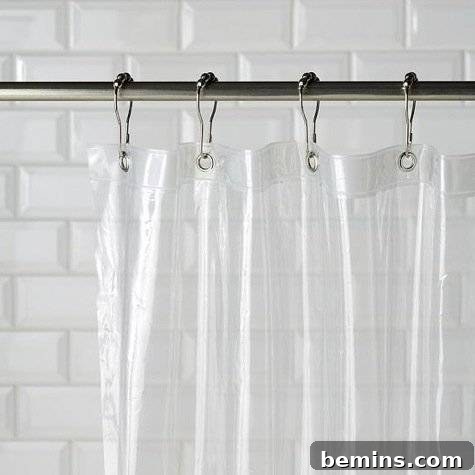 Ultimate Home Cleaning Guide: Room-by-Room Secrets 17 White shower curtain hanging on a rod.