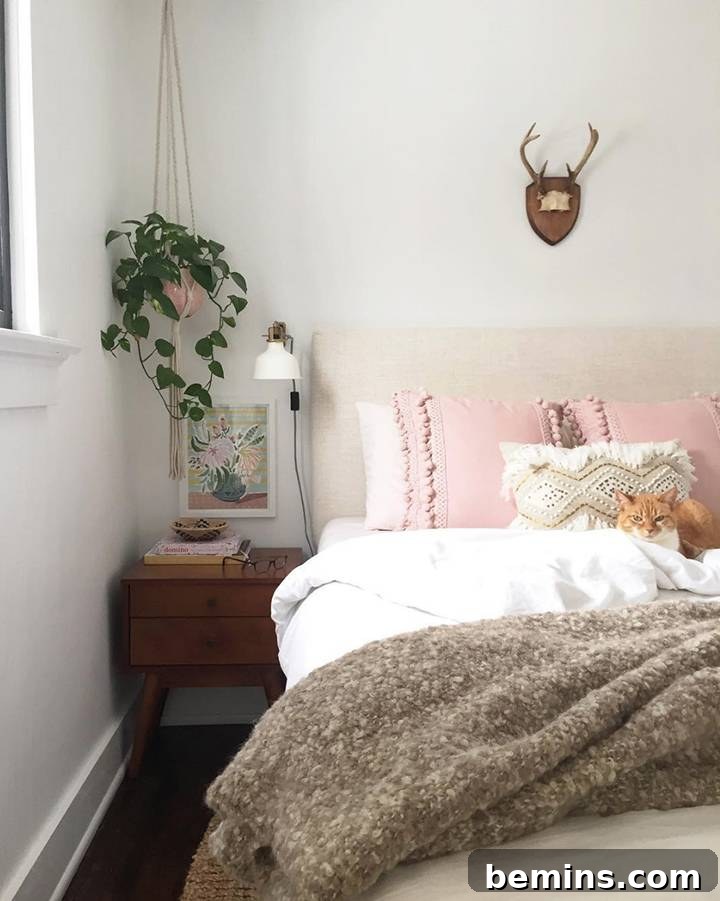 Bohemian bedroom with subtle pink accents, natural light, and relaxed styling, shared by Carpendaughter.