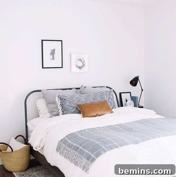 Minimalist bohemian living room with clean lines, a textured rug, and subtle decor, curated by Inspired By Lynne.