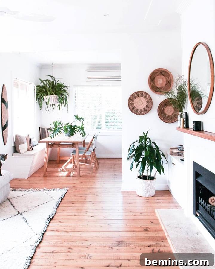 Richly textured bohemian space with numerous plants, woven baskets, and a relaxed seating area from Hutchinson House.
