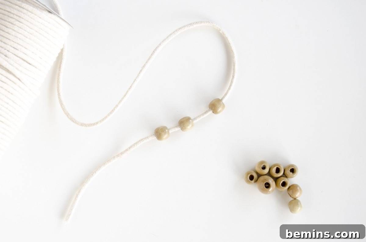 Not Macrame: A Fresh Take on DIY Plant Hangers 6 Macrame cord with three wooden beads strung onto it
