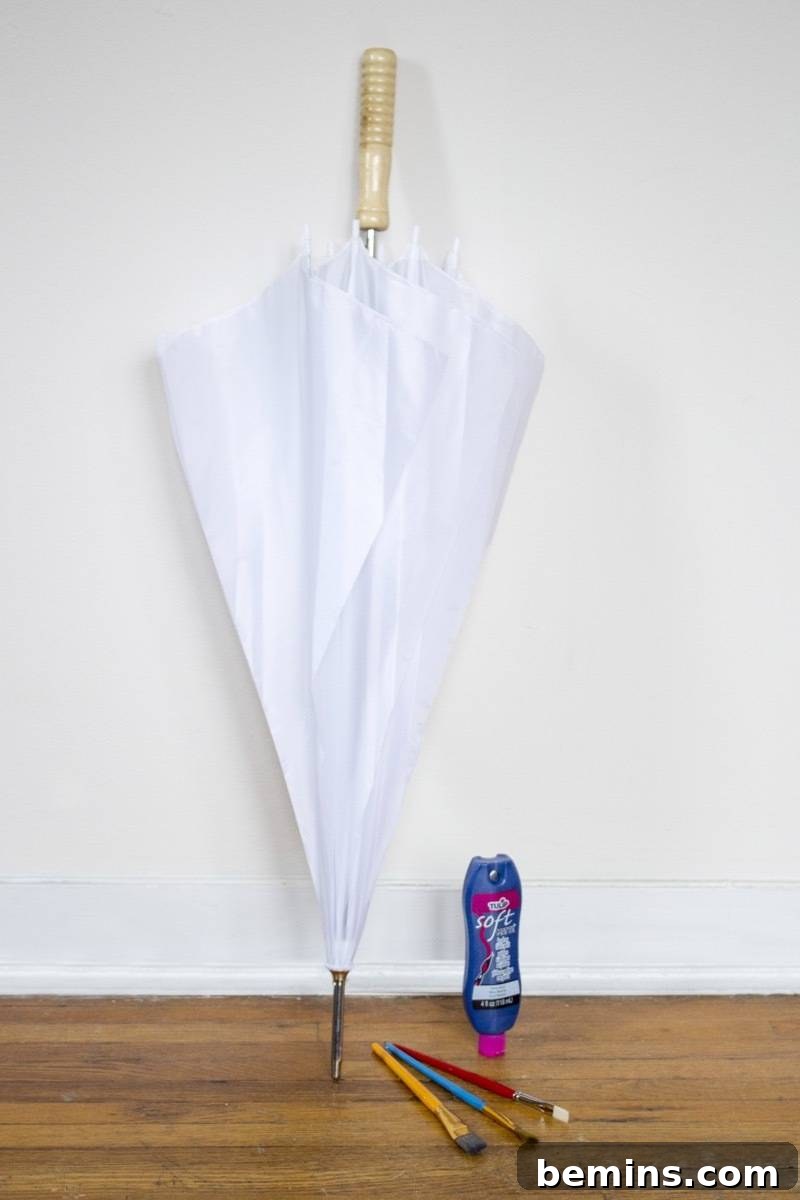Materials for painting an umbrella: white umbrella, fabric paint, paintbrushes