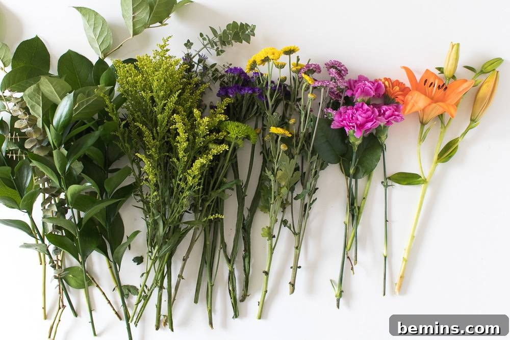 Turning Everyday Grocery Store Flowers into Stunning Floral Art 3 Flowers neatly organized by type on a white surface.