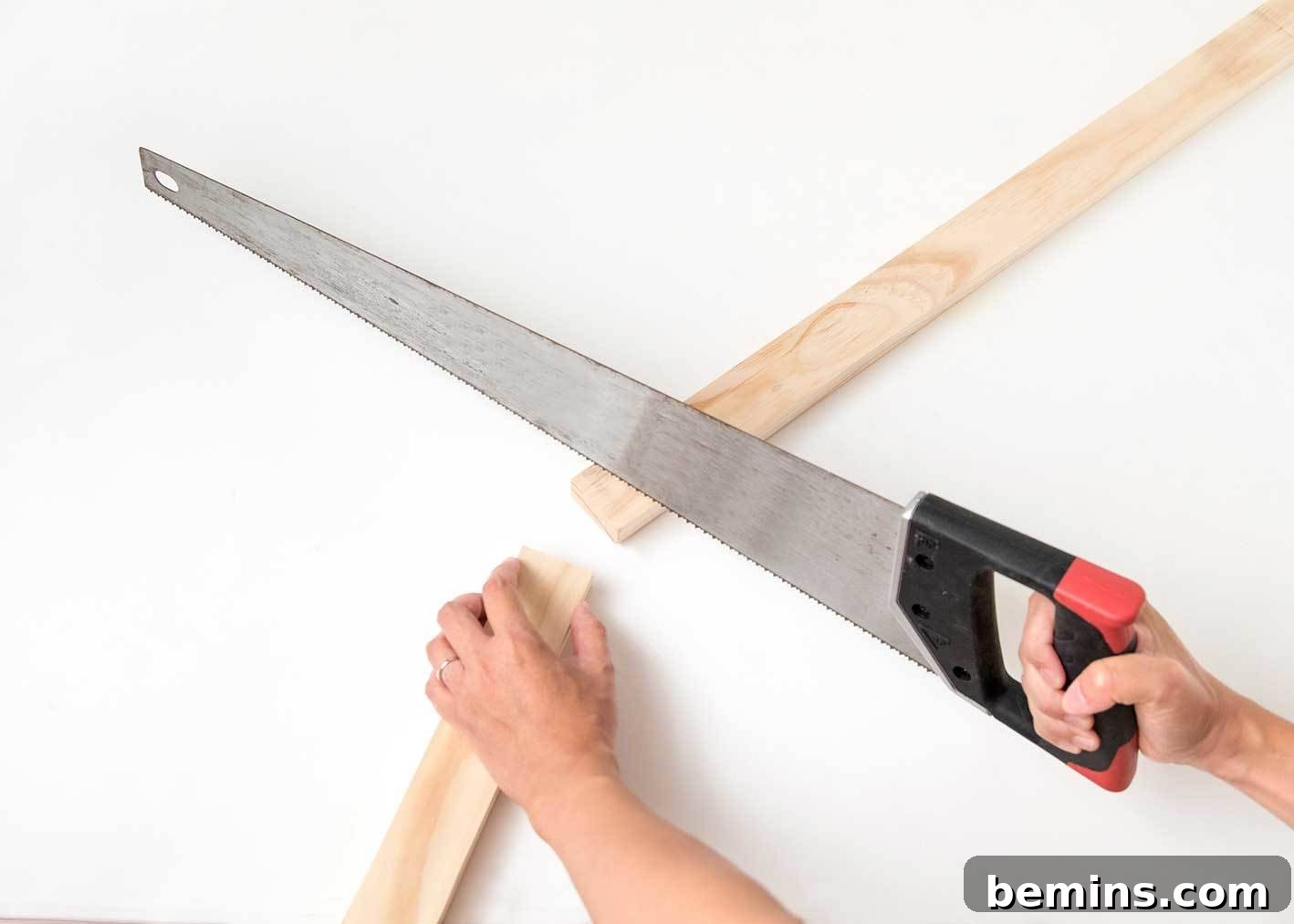 Cutting wood pieces for the fabric wall art frame.