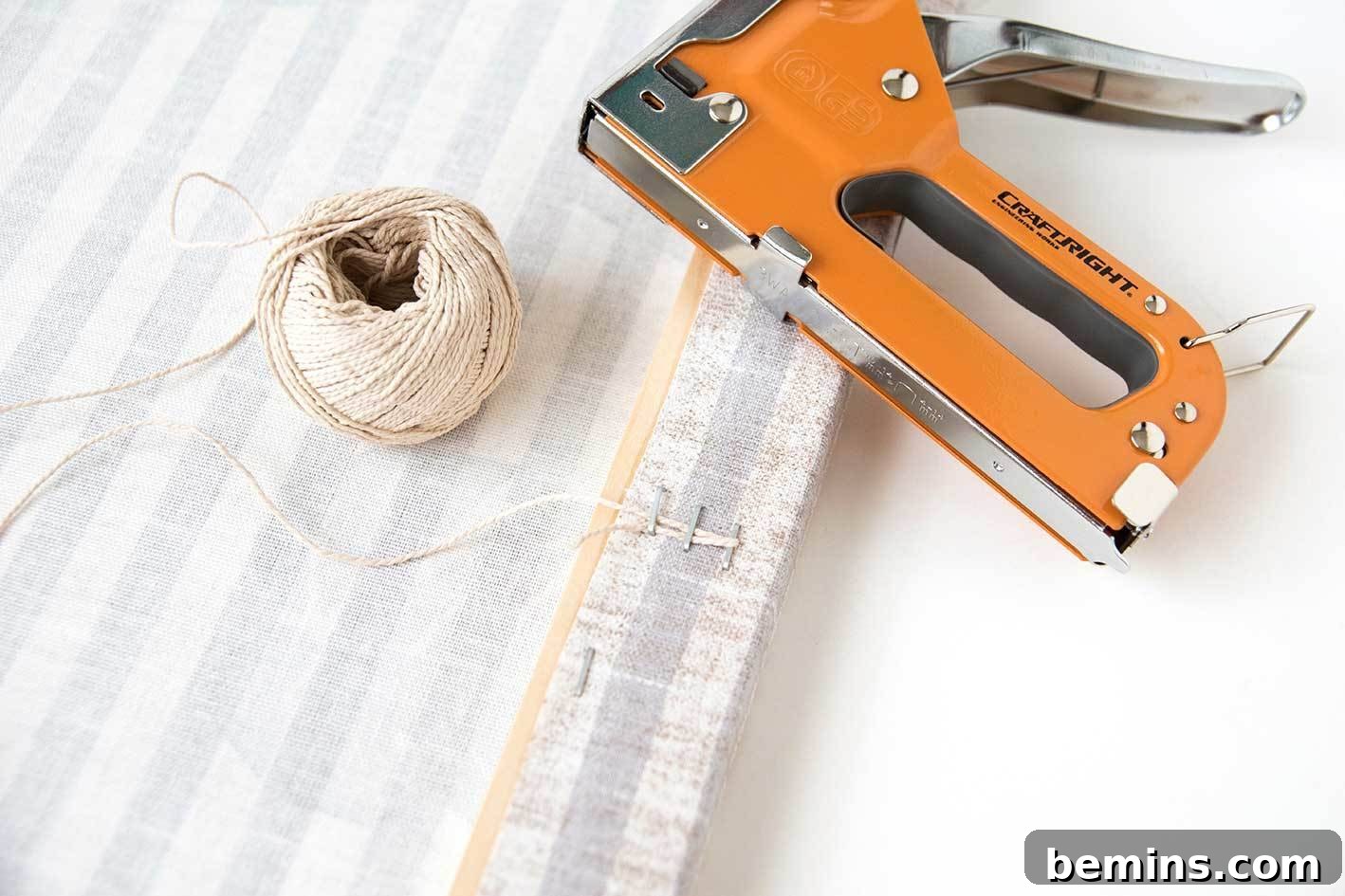 Securing the hanging cord with staples.