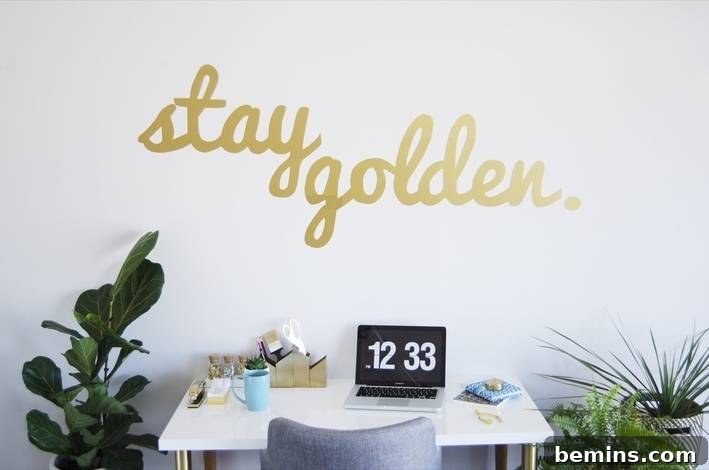 Close-up of a typographical wall decal with an inspiring message.