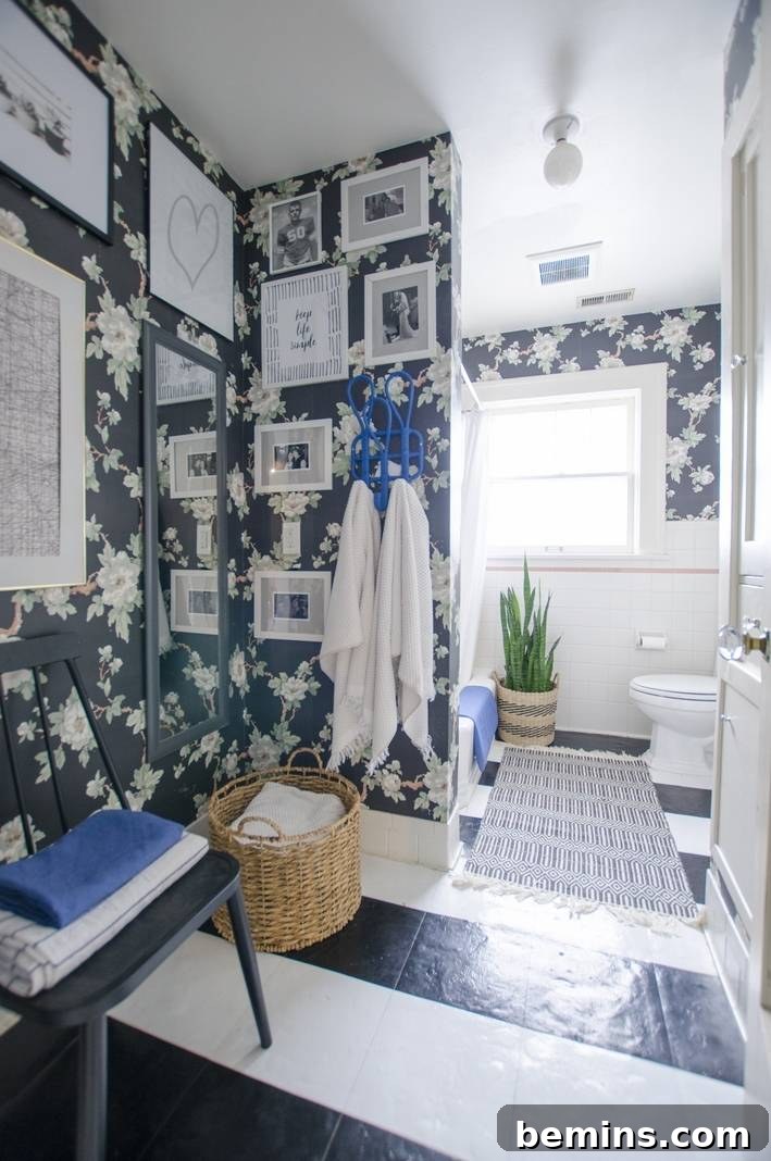 Bathroom featuring striped peel-and-stick floor tiles, adding personality to a small space.