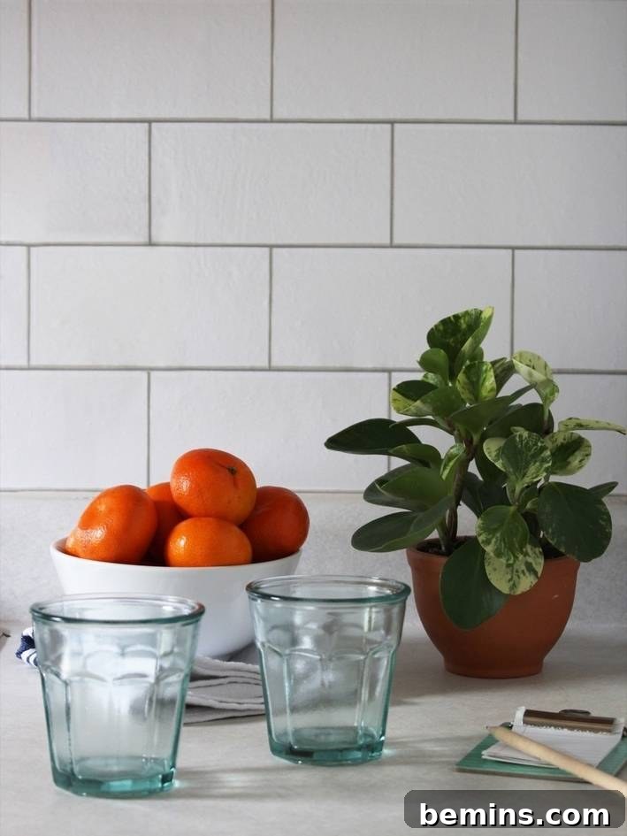 Kitchen with a faux backsplash created using removable wallpaper.