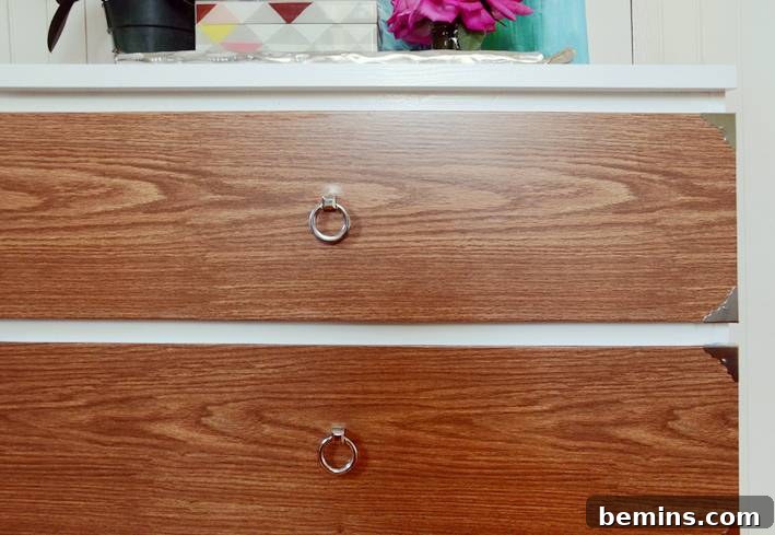 IKEA Malm dresser transformed into a stylish campaign-style dresser.