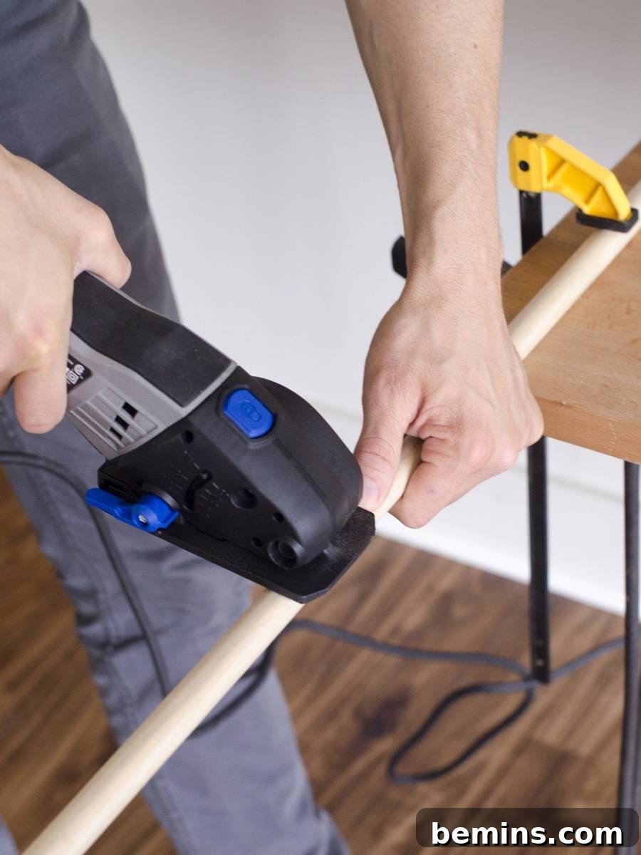 Cutting the dowel to create the plant stand legs