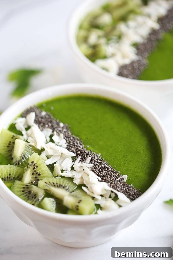 Tropical green smoothie bowls with fruit and nuts
