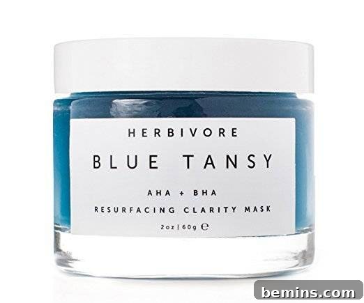 A jar filled with a vibrant blue skincare substance, indicative of its unique formulation and natural ingredients.