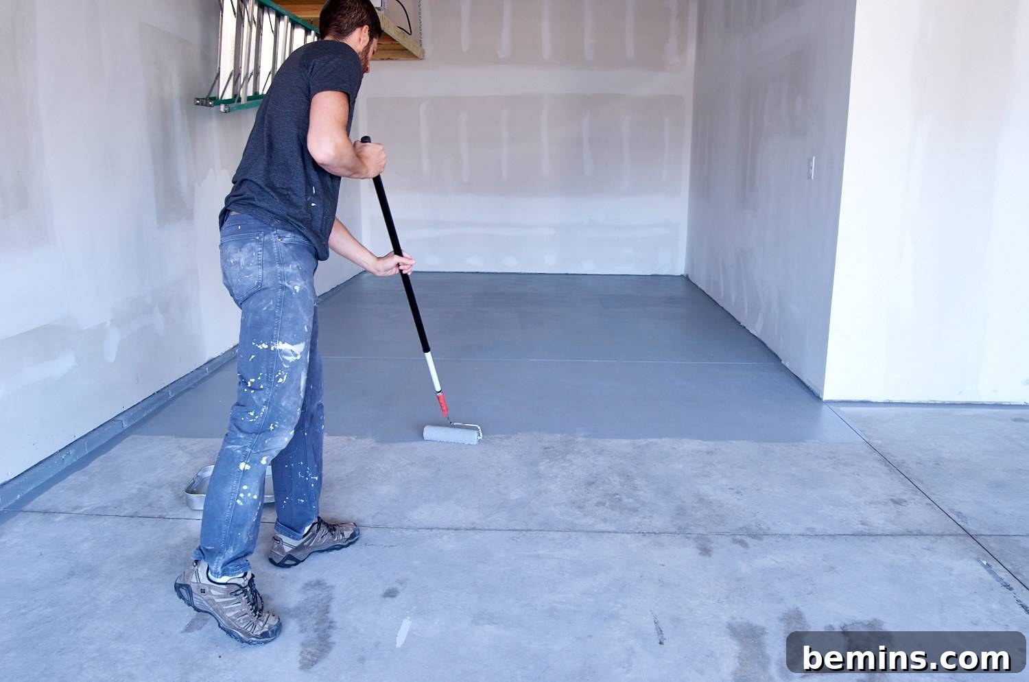 roll the paint on the concrete using a normal paint roller and pole