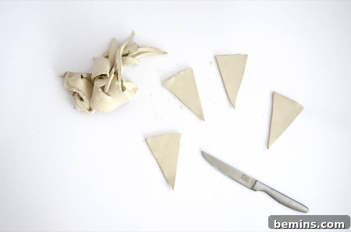 Cutting out the clay triangles