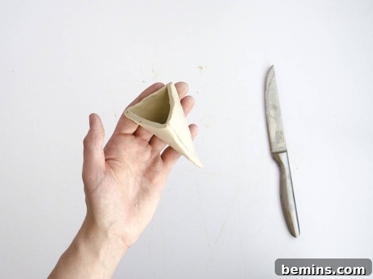 Assembling the clay pyramid