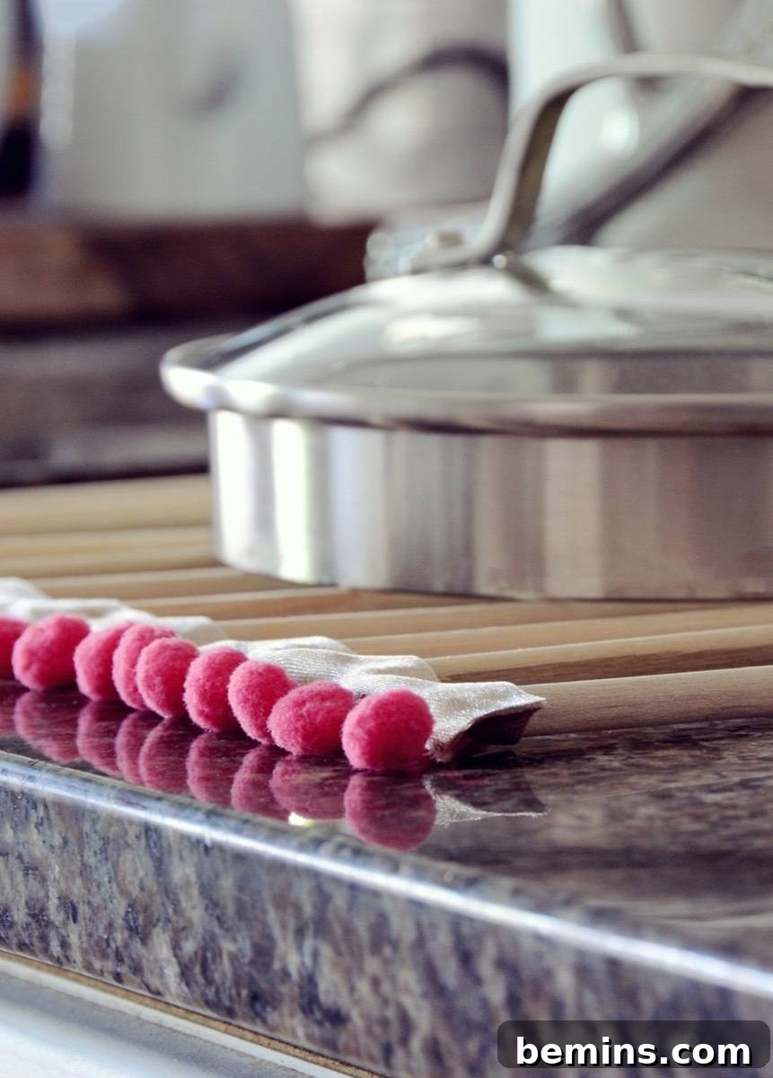 Adding Pom Pom Trim to the Roll-Up Dish Drying Rack
