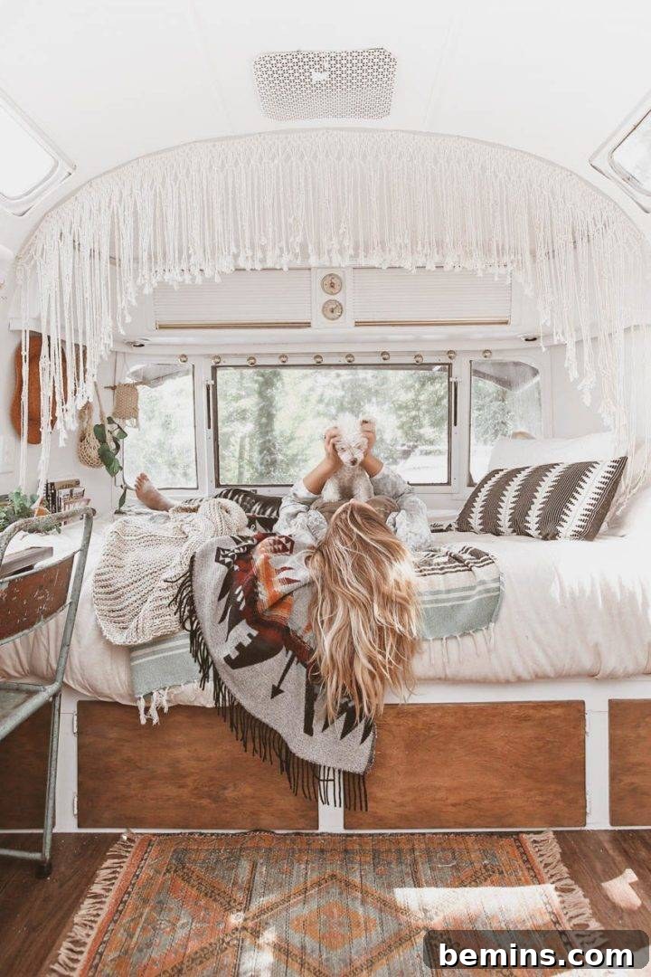 An outdoor living space set up near a renovated Airstream, showcasing a boho-inspired aesthetic.