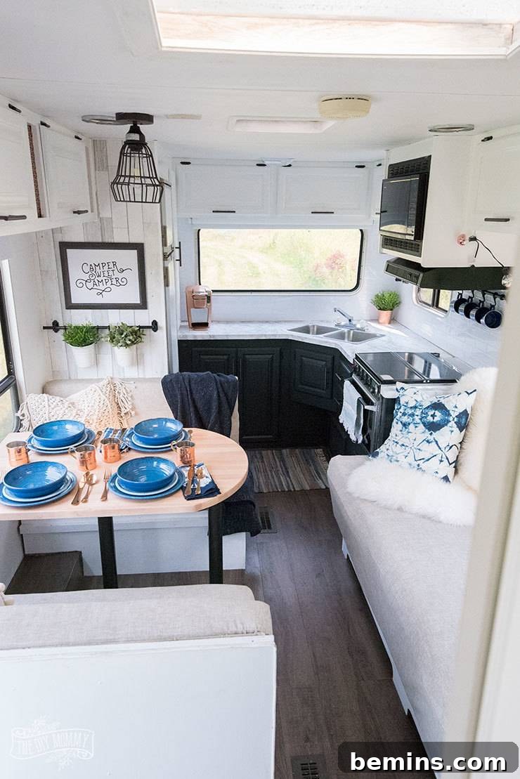 A cozy and inviting living area inside a renovated camper, showcasing bright and airy design elements.
