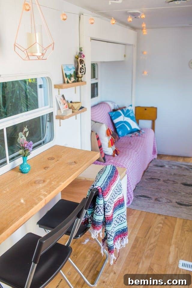 A cute and feminine camper interior design, showcasing thoughtful details and a comfortable atmosphere.