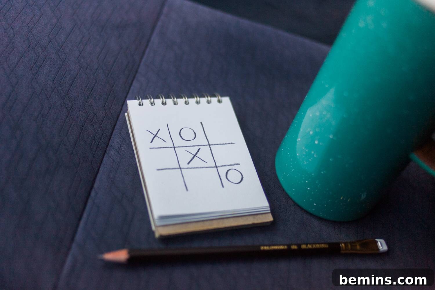 Road trip games: tic-tac-toe in the car with a travel mug