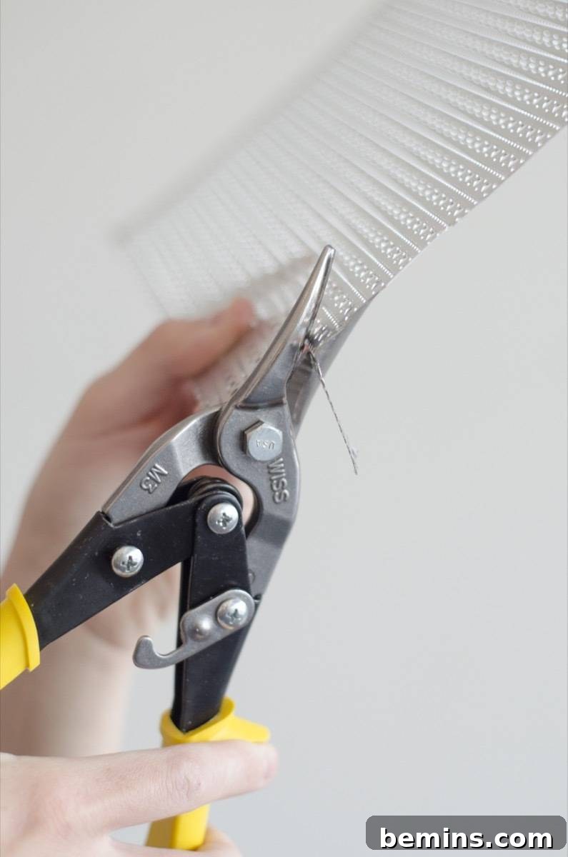 Cutting metal with a pair of Wiss Aviation Snips