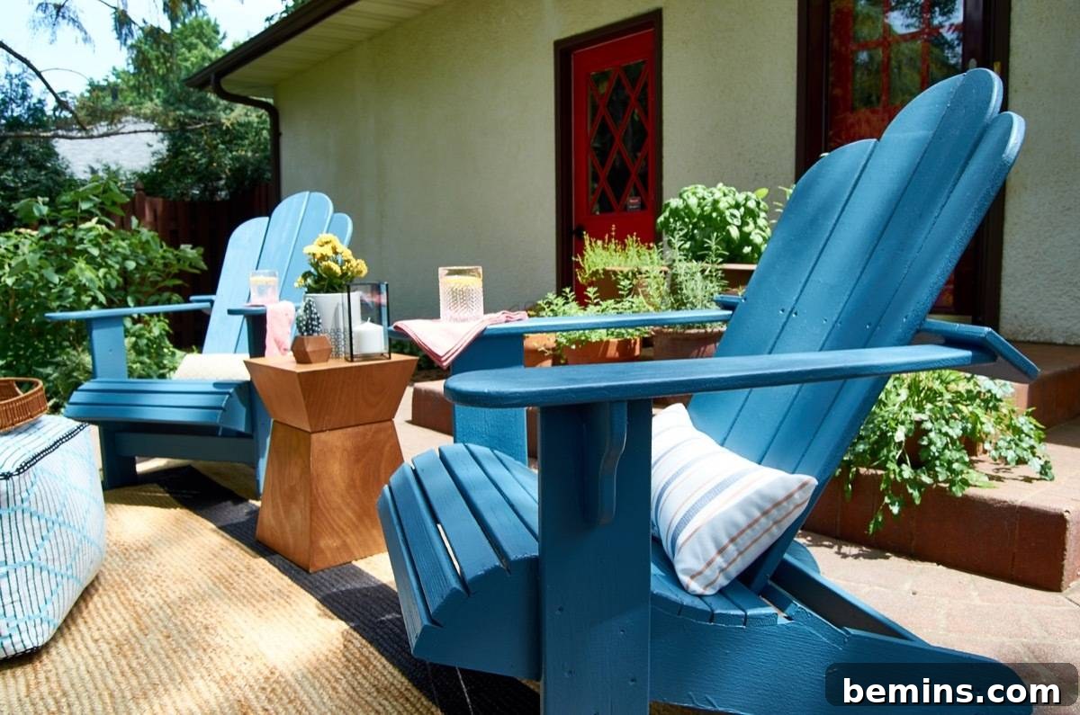 Summer-Ready Patio: A Fast & Fun Refresh 17 Outdoor patio with two blue chairs and white throw pillows nestled between a modern wood end table.