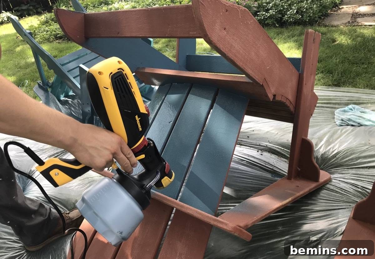 Summer-Ready Patio: A Fast & Fun Refresh 4 Spraying a patio chair with a Wagner Paint Sprayer