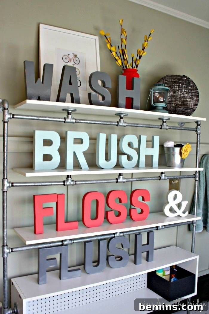 Bathroom with a decorative monogram on the wall