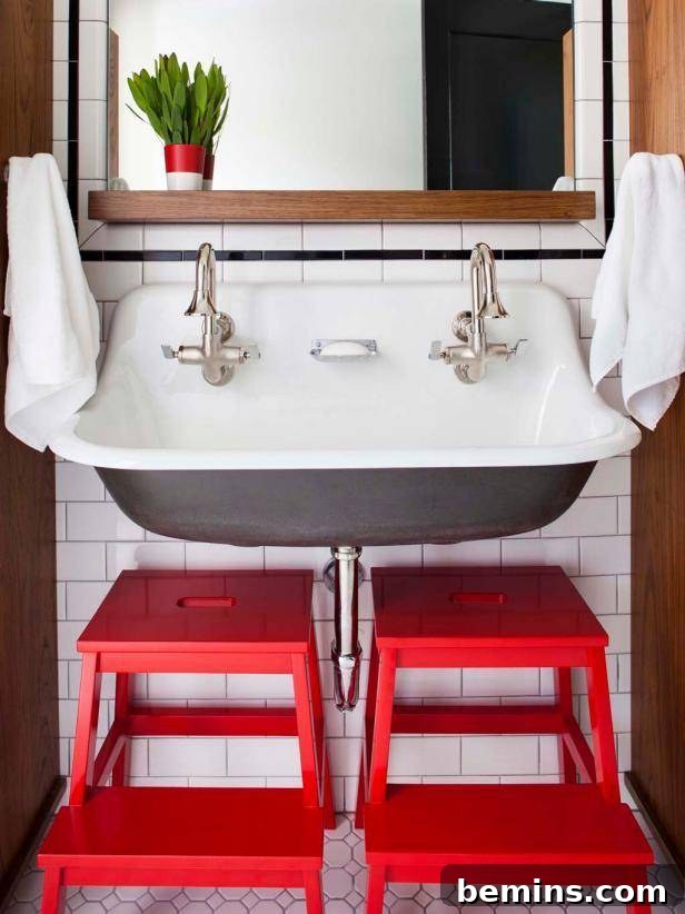 Bathroom with a bright blue accent wall and colorful accessories