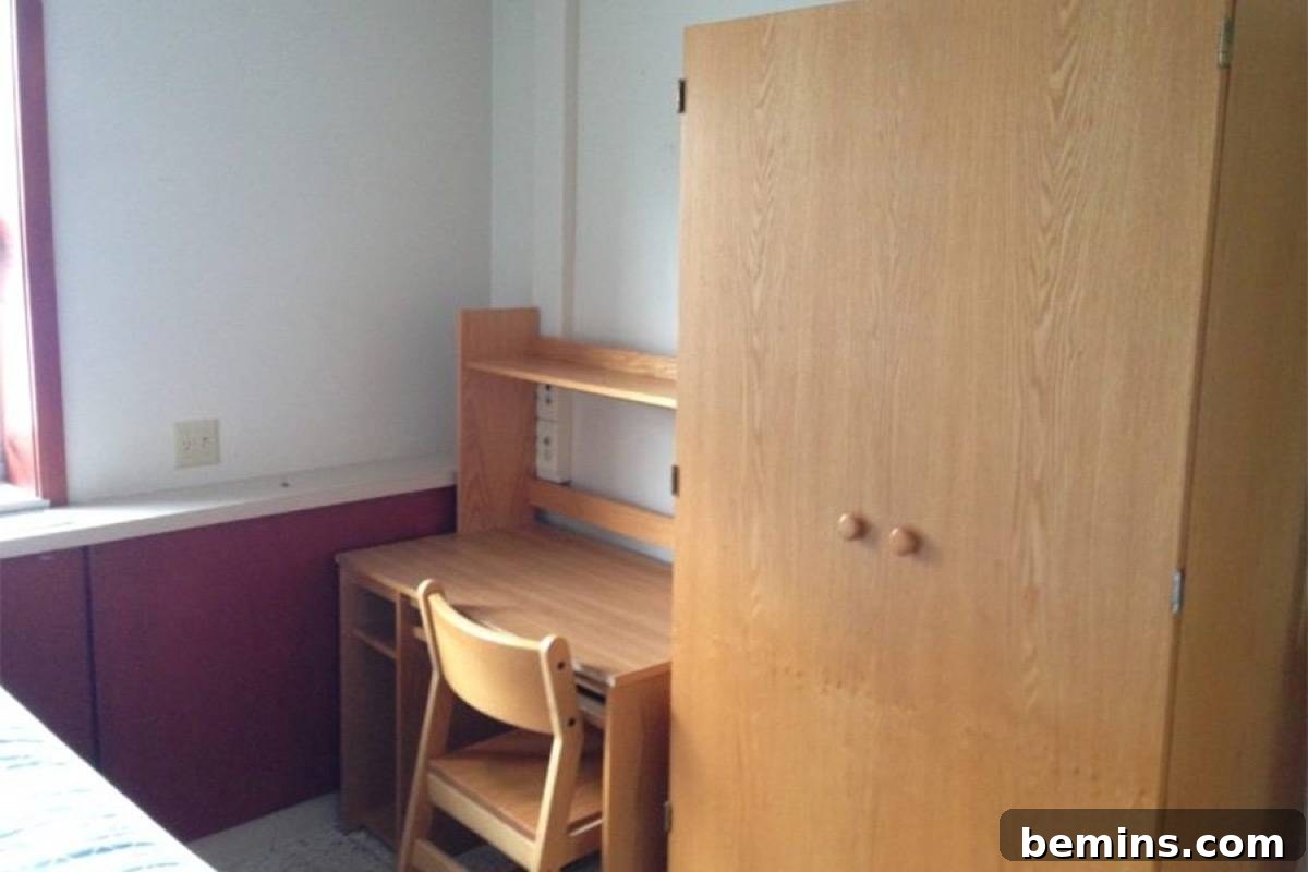 Before: Light brown wooden furniture sits next to a purple wall.