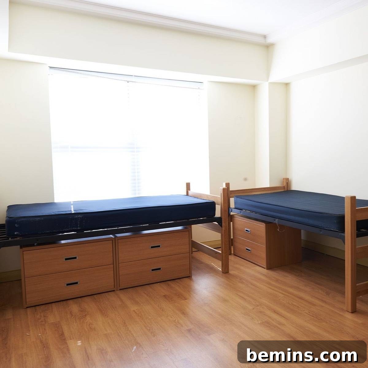 Before: Two twin beds sit perpendicular to each other in the corner of a bright room.